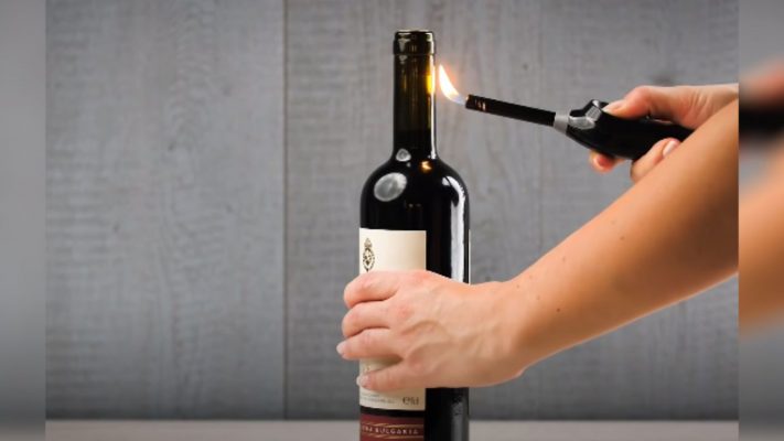 How to open wine by heating the air at the neck of the bottle